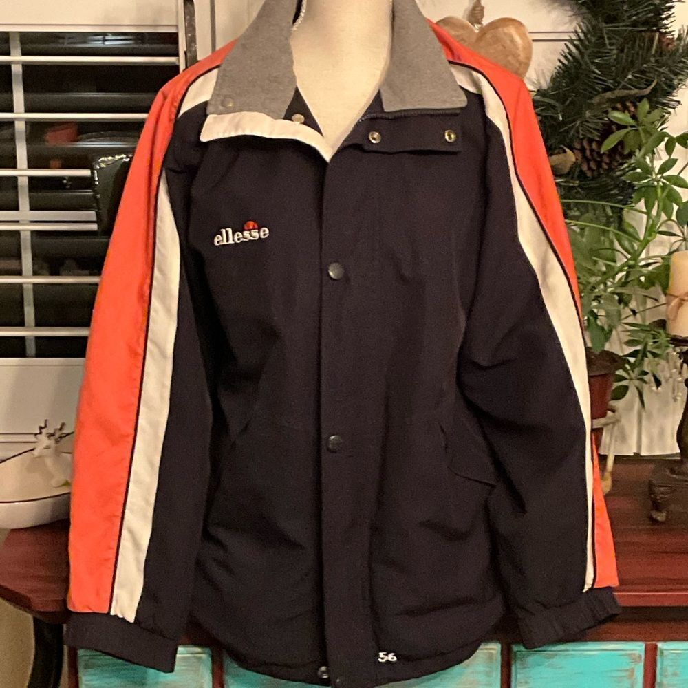 Ellesse unisex jacket. Zip up and button closures